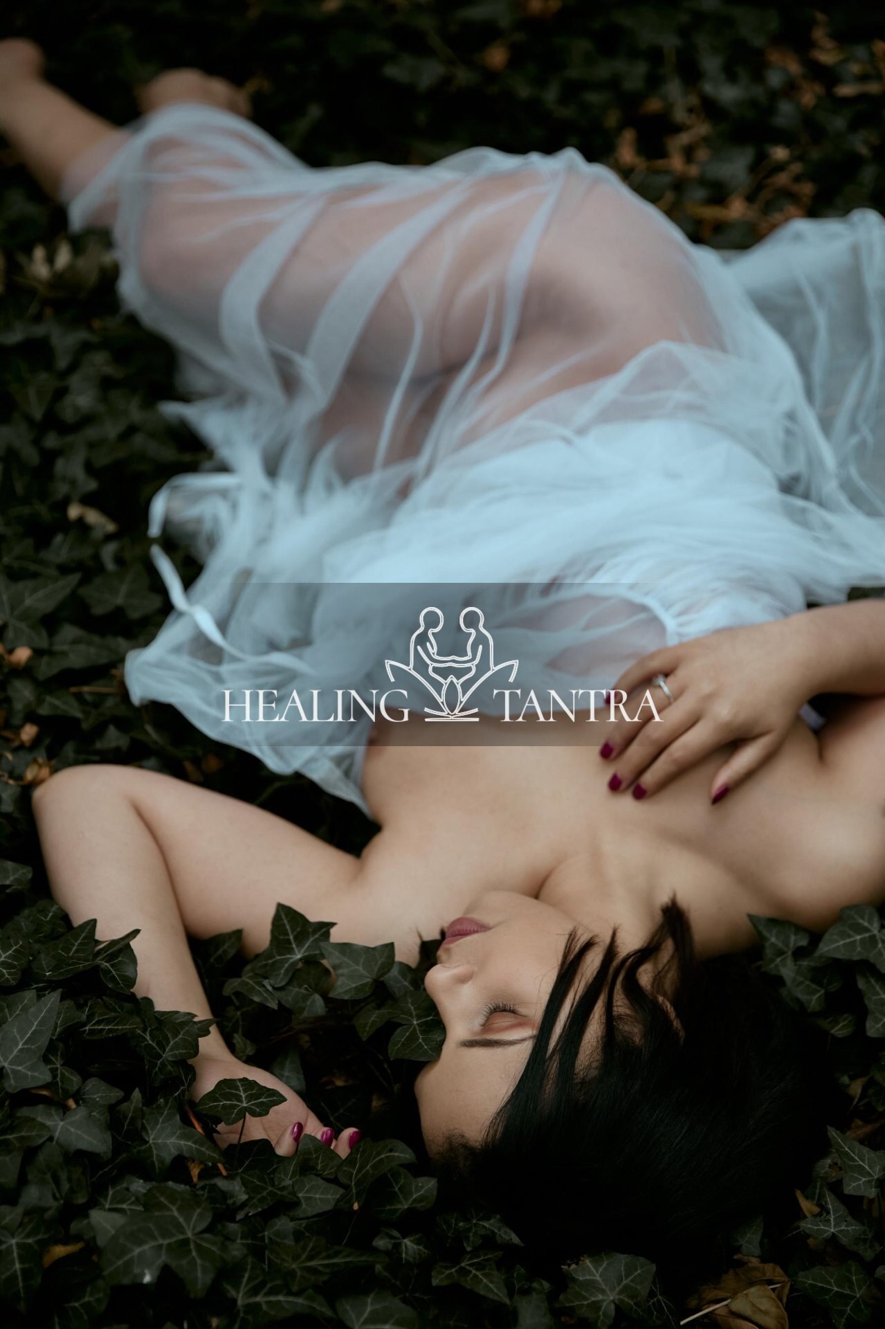Resting on a bed of ivy, tulle gathered at the waist