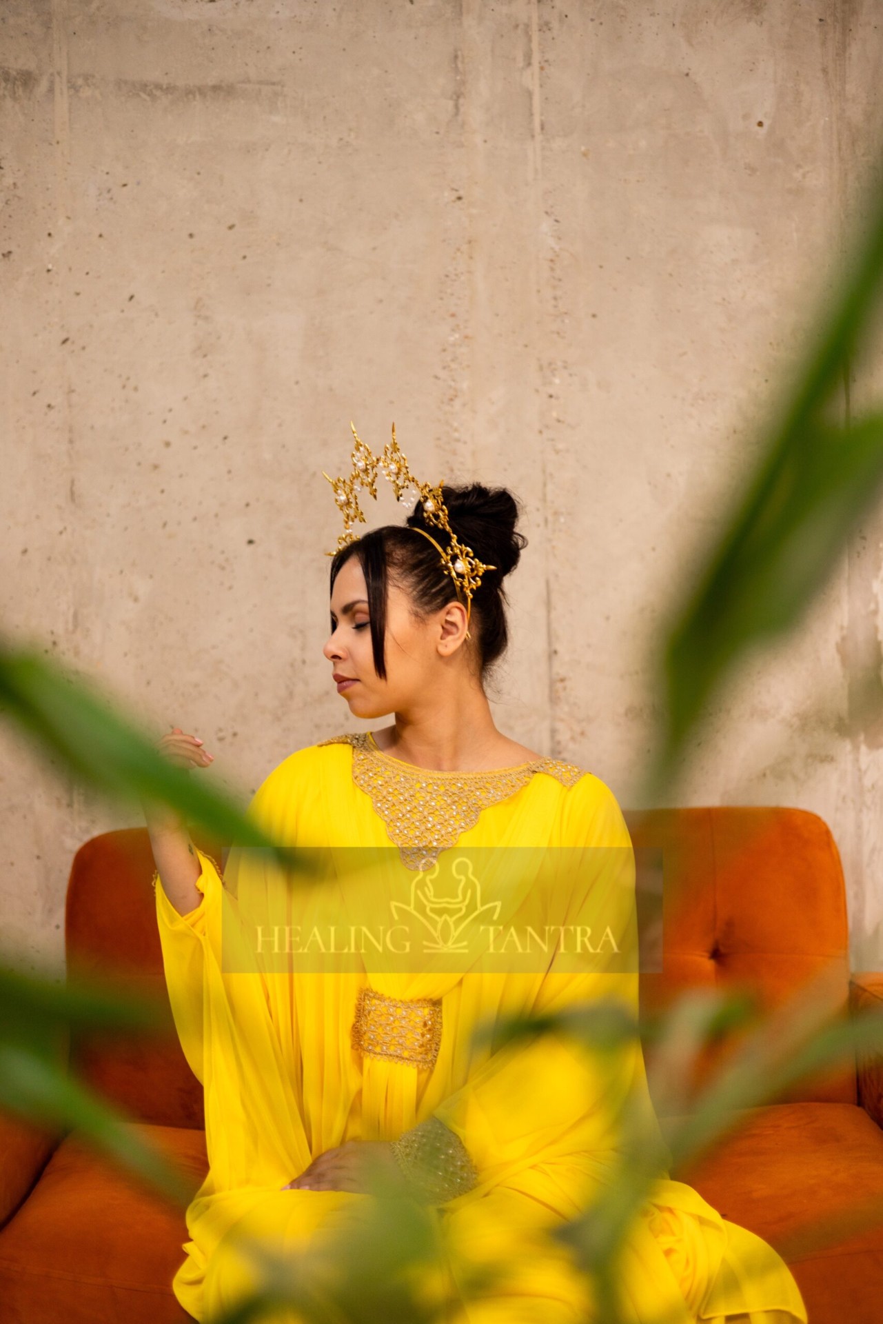 Crowned in gold, eyes lowered