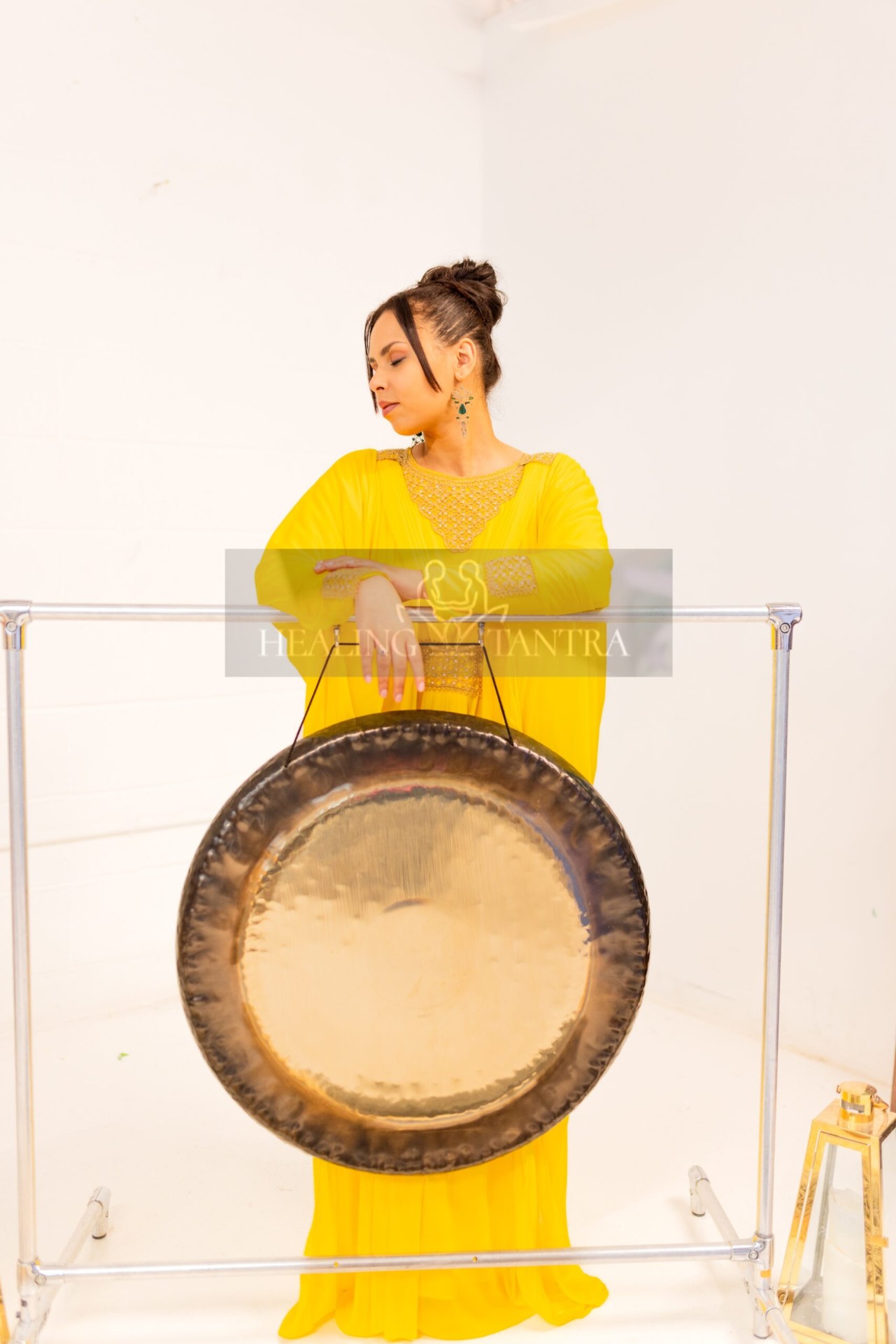 Elira holding the gong